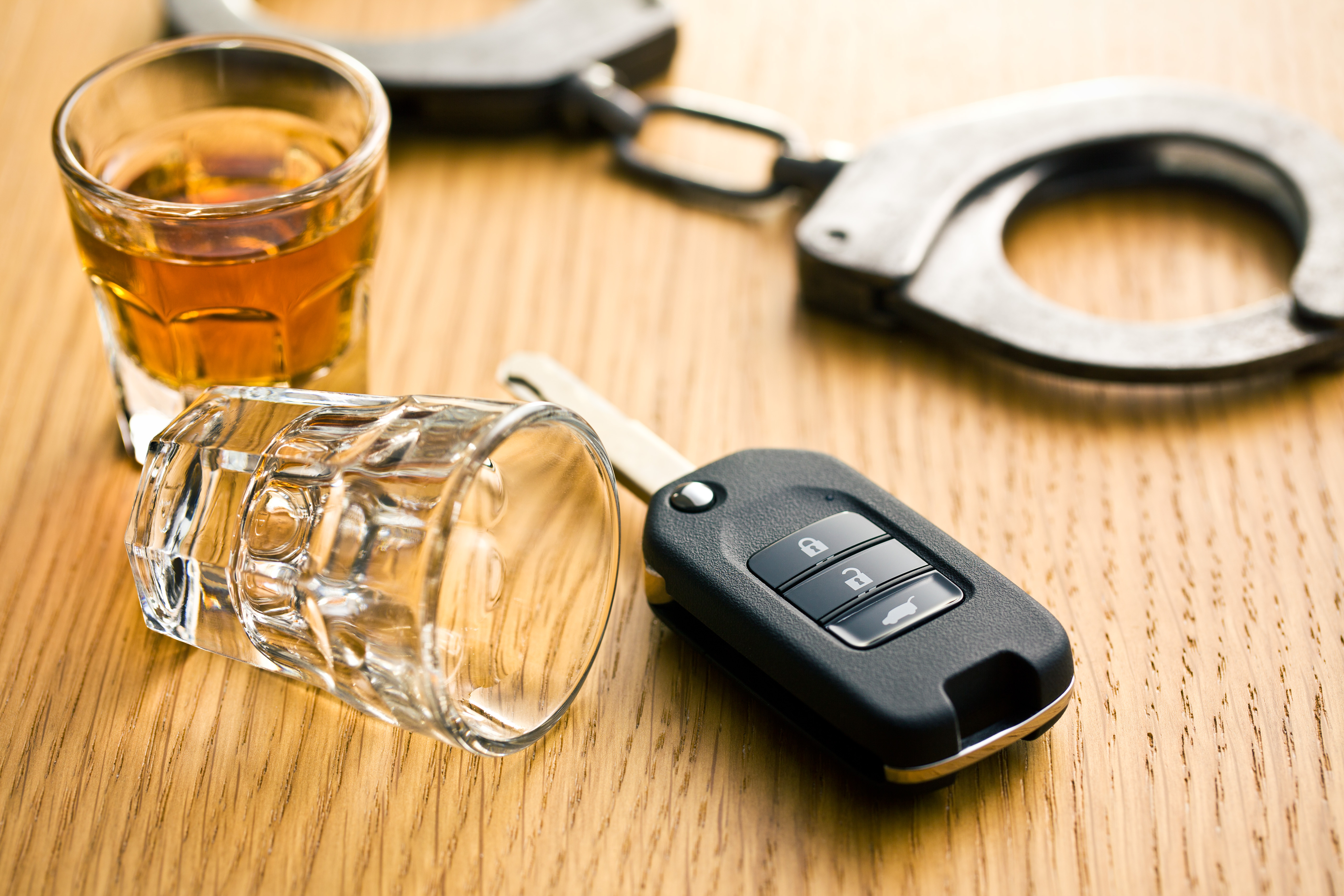 car keys with a shotglass