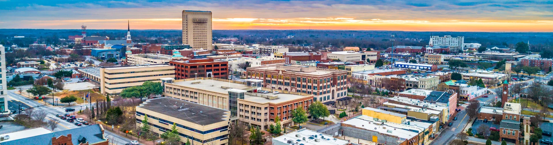 The city of Charlotte, NC, illuminated by a vibrant sunset